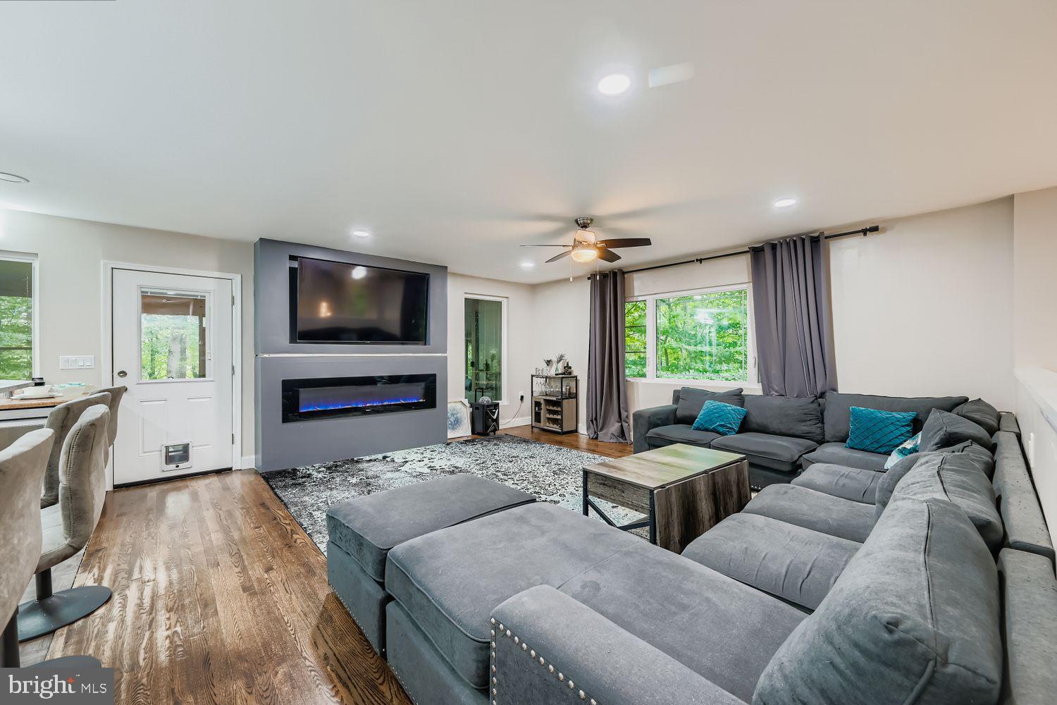 3203 Brezina Place Edgewater, MD 21037 - Photo 5 of 42 a living room with furniture and a flat screen tv