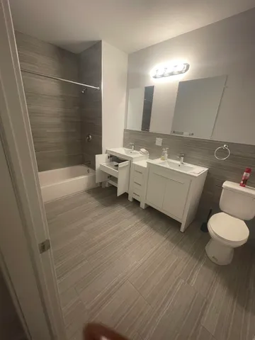 a bathroom with a sink and mirror