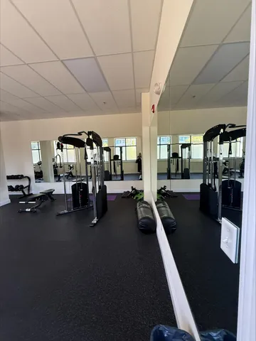a view of water heater room with wooden floor