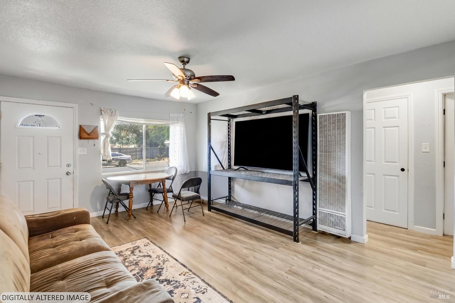 1722 Indiana Street Fairfield, CA 94533 - Photo 10 of 18 a living room with furniture and a flat screen tv