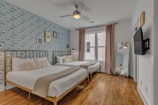 a bedroom with bed and window
