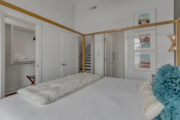 a bedroom with a bed and a cabinets