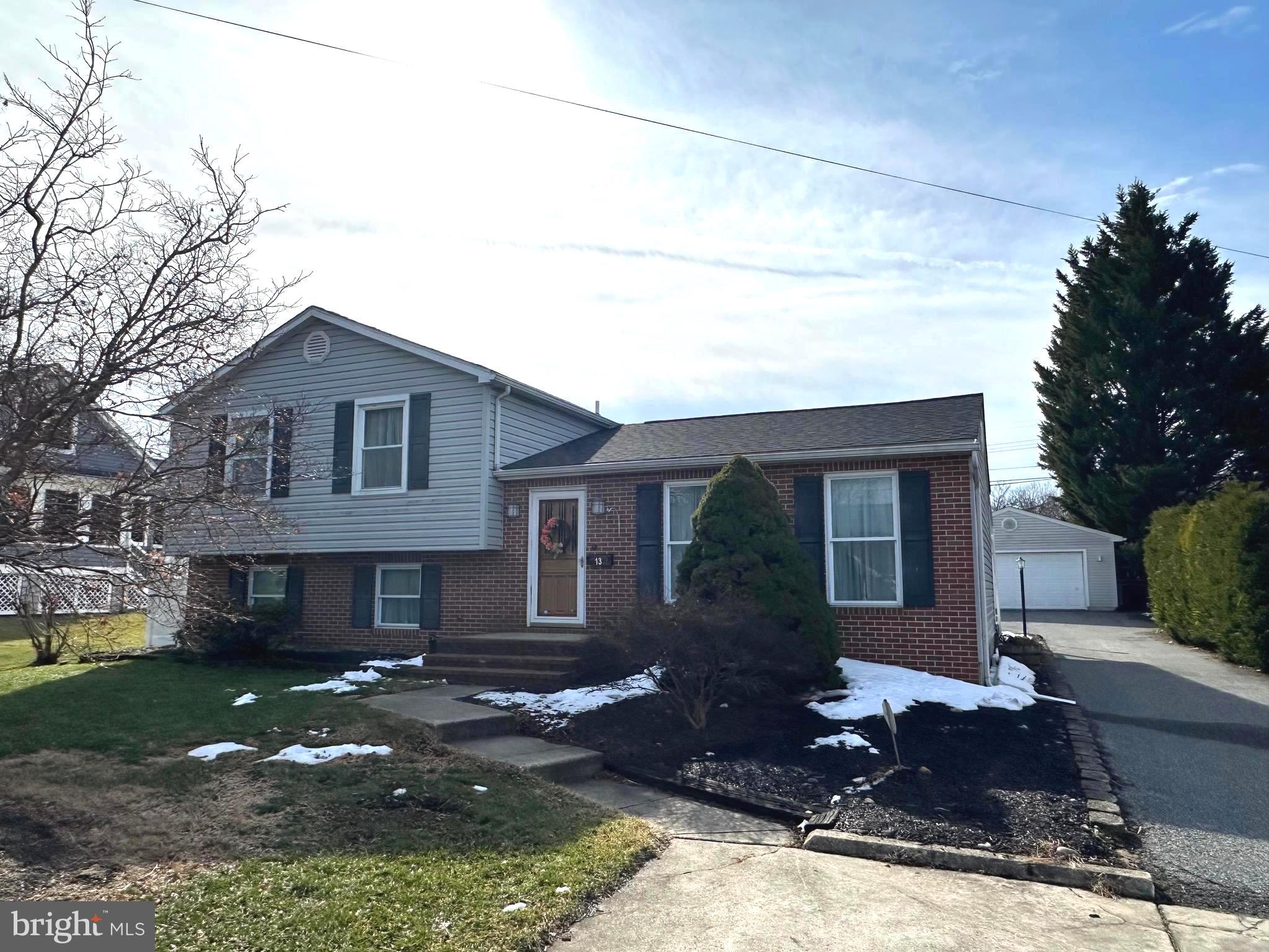 13 Cinder Road Lutherville-Timonium, MD 21093 - Photo 1 of 28 a front view of a house with a yard