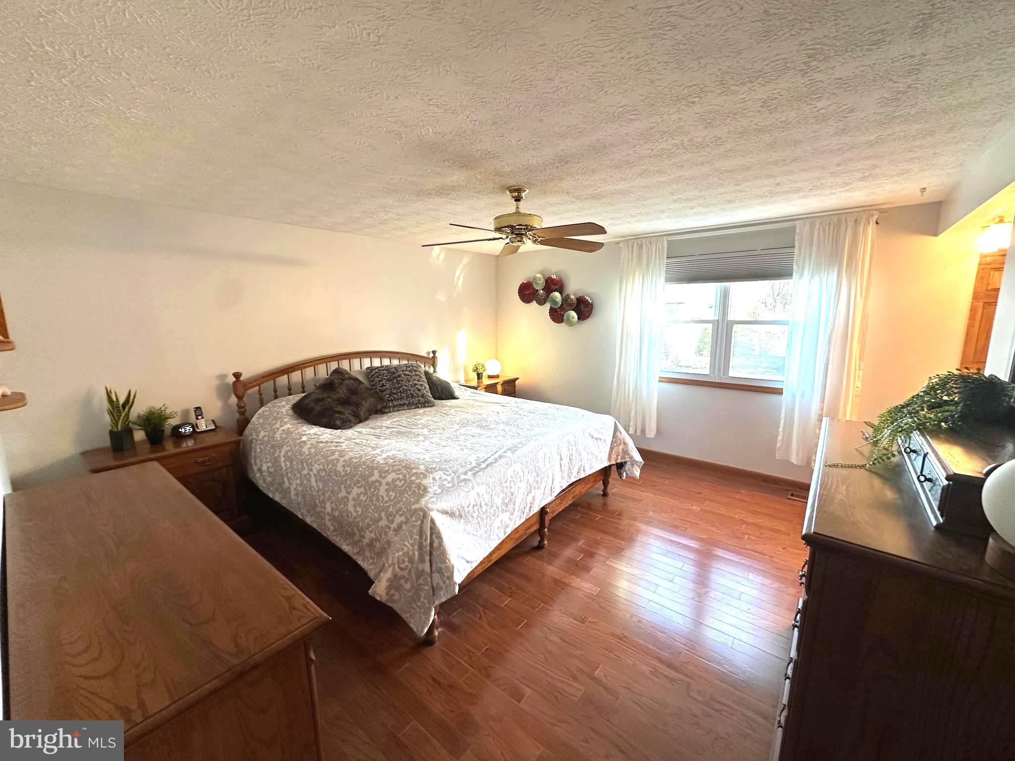 13 Cinder Road Lutherville-Timonium, MD 21093 - Photo 13 of 28 a bedroom with a bed and a flat screen tv