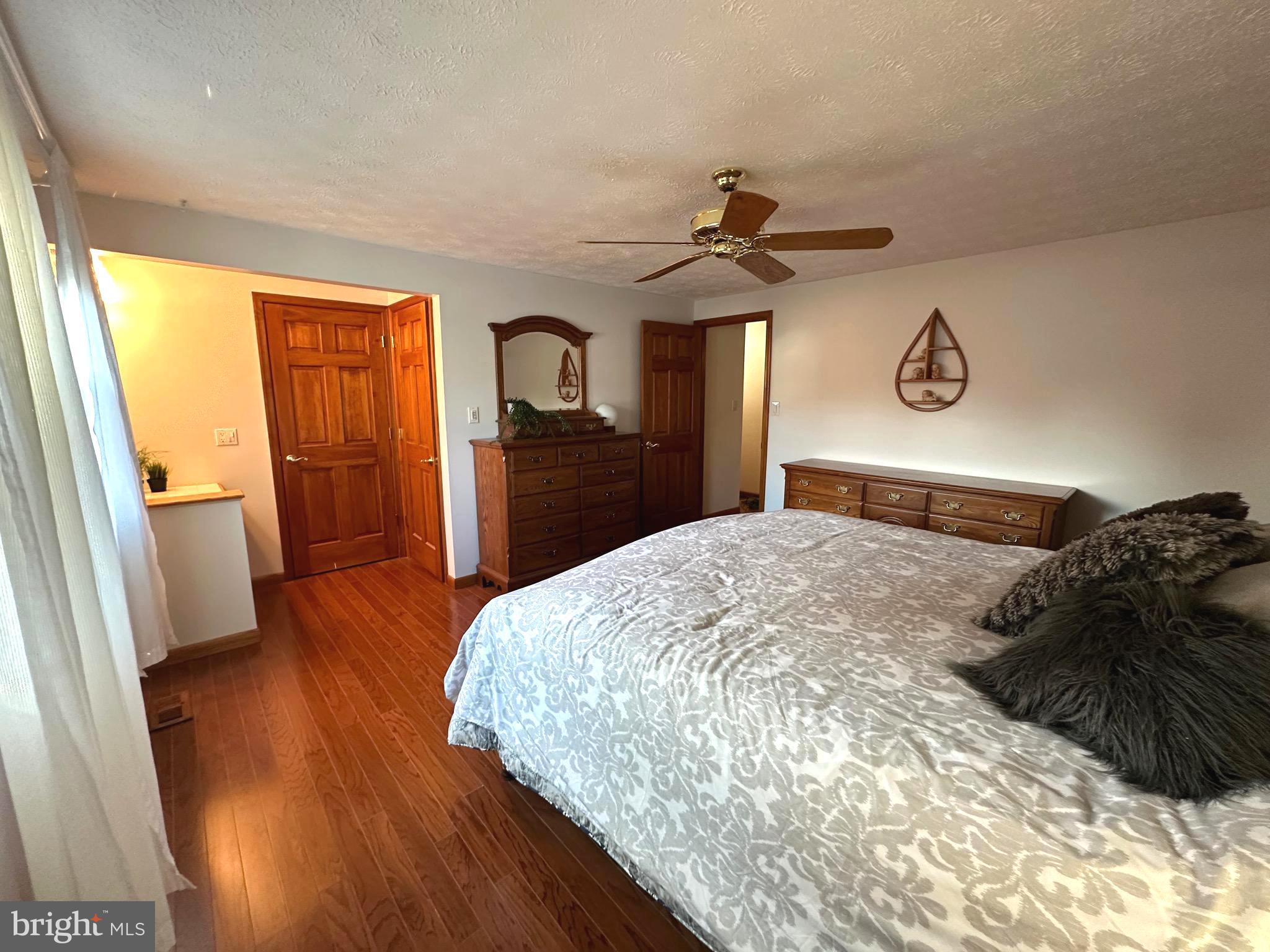 13 Cinder Road Lutherville-Timonium, MD 21093 - Photo 15 of 28 a bedroom with a bed and wooden floor