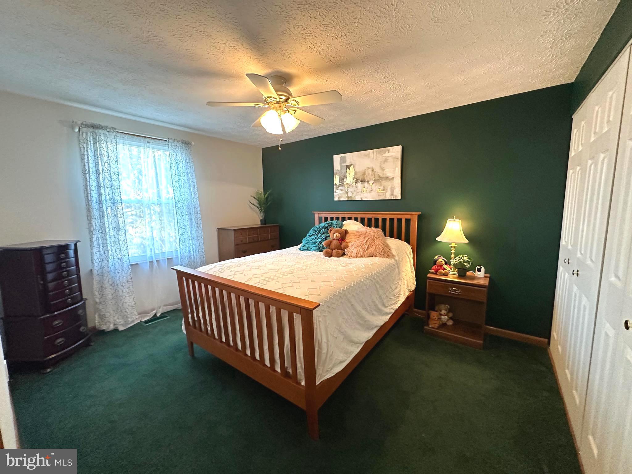 13 Cinder Road Lutherville-Timonium, MD 21093 - Photo 17 of 28 a bed sitting in a bedroom next to a window