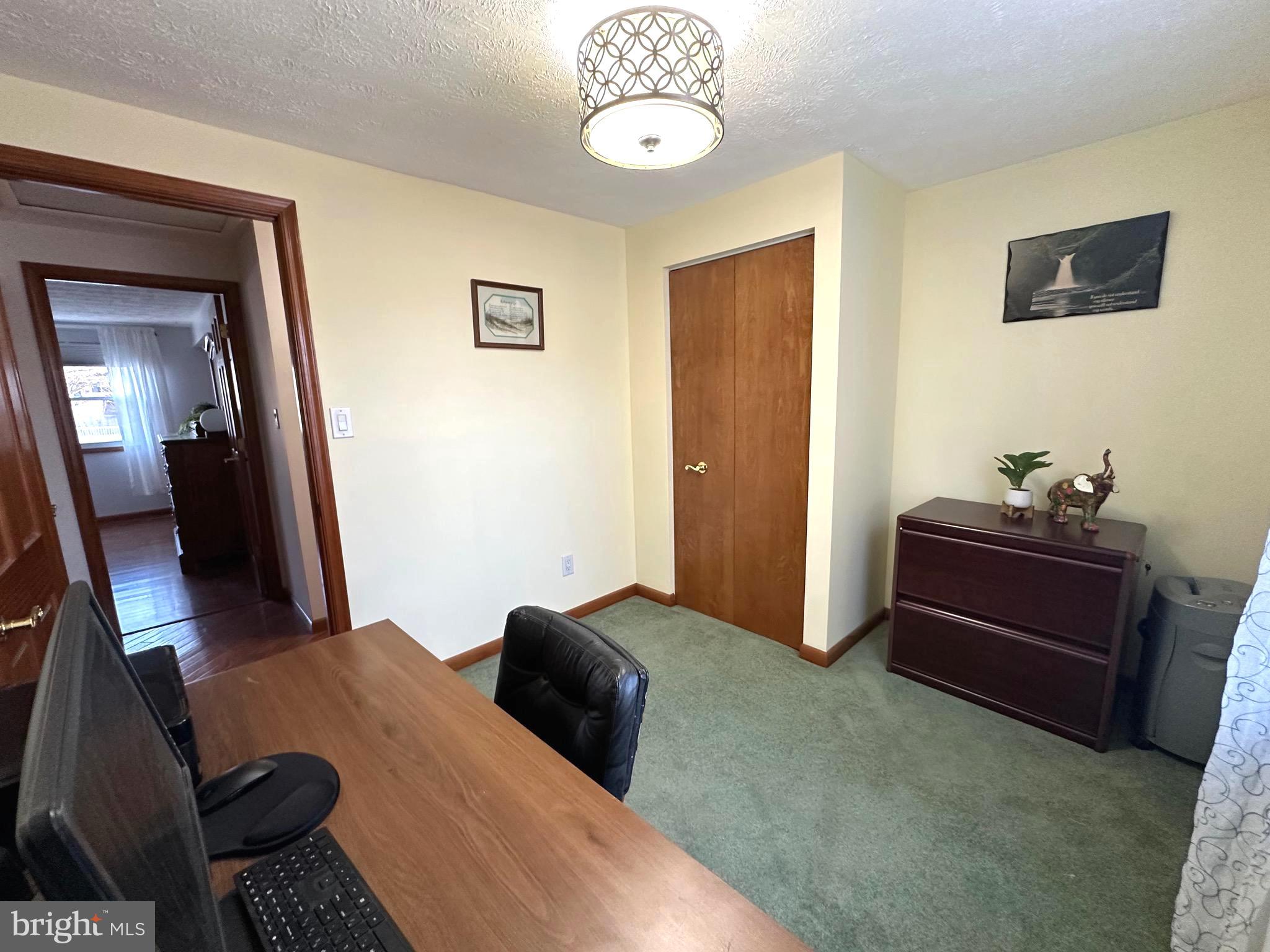13 Cinder Road Lutherville-Timonium, MD 21093 - Photo 20 of 28 a bedroom with a bed and a chandelier