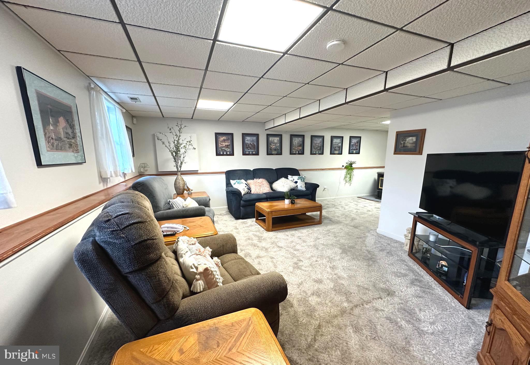 13 Cinder Road Lutherville-Timonium, MD 21093 - Photo 21 of 28 a living room with furniture and a flat screen tv