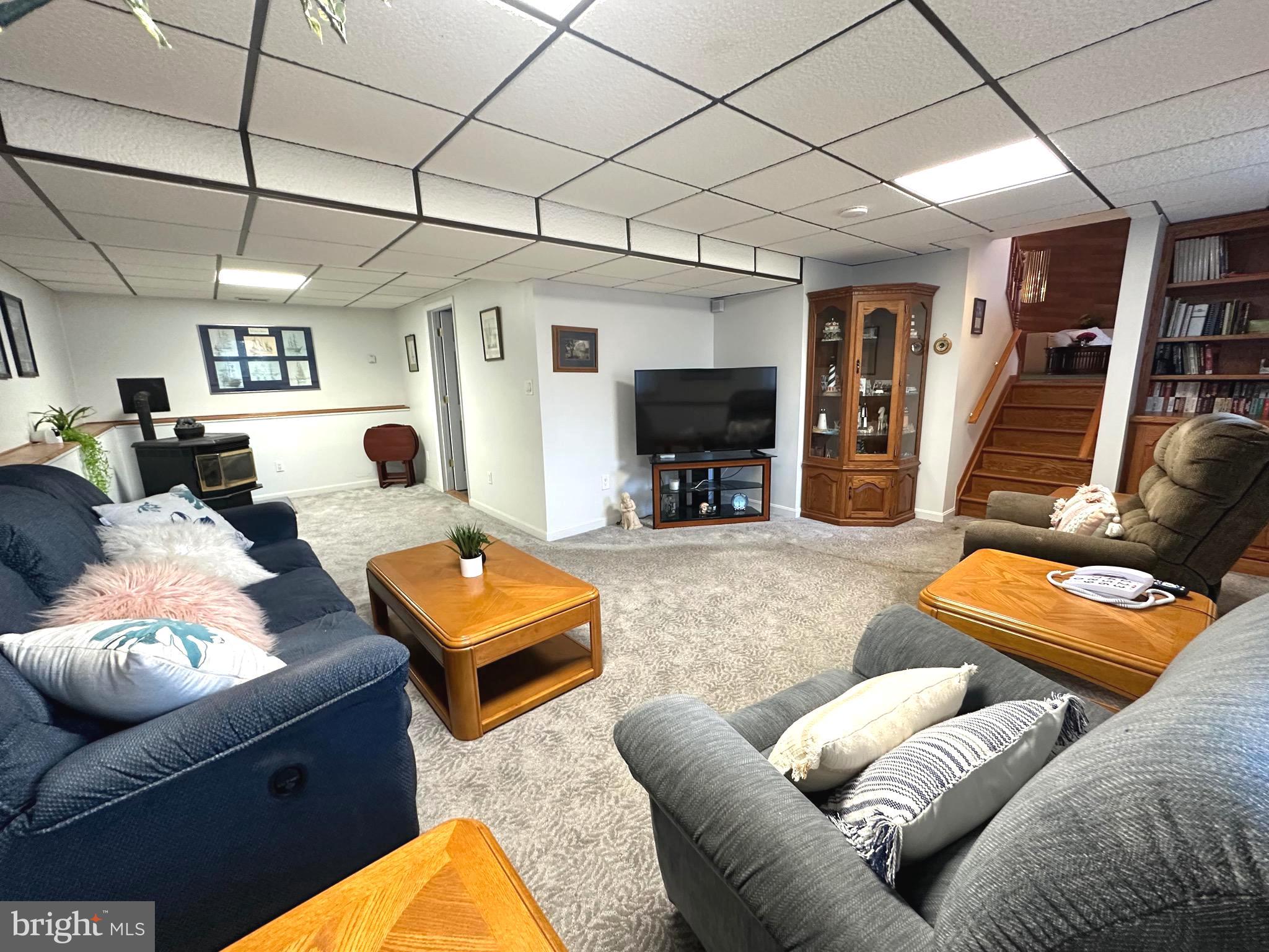 13 Cinder Road Lutherville-Timonium, MD 21093 - Photo 4 of 28 a living room with furniture and a flat screen tv