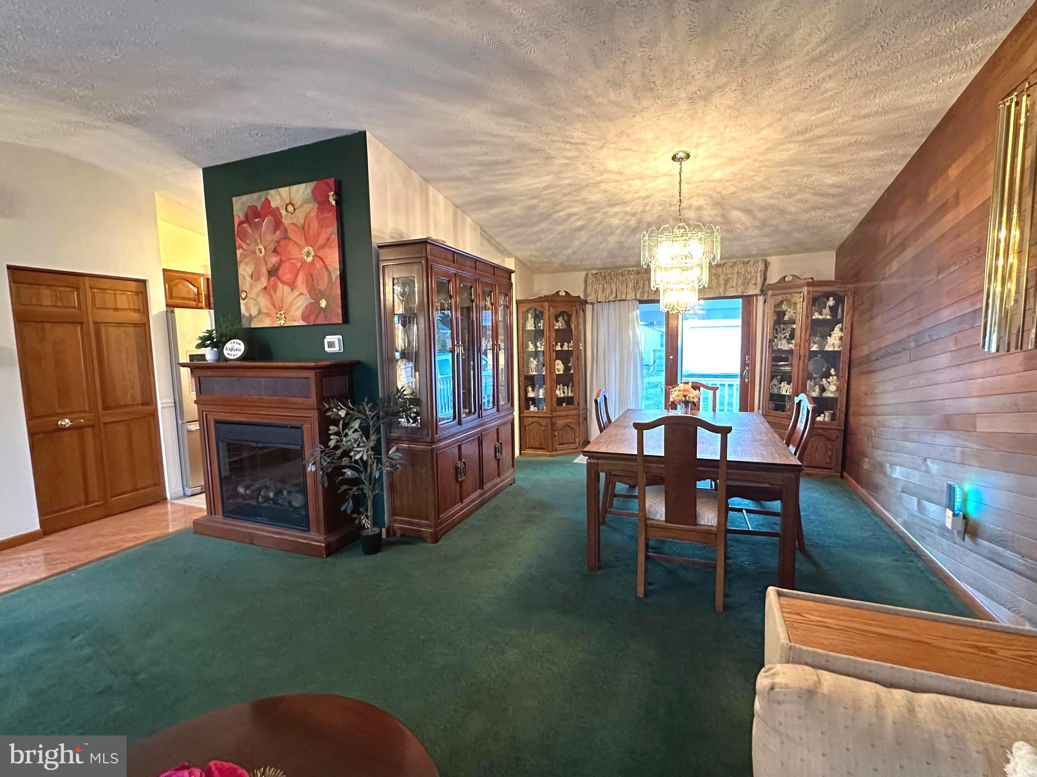 13 Cinder Road Lutherville-Timonium, MD 21093 - Photo 7 of 28 a living room with furniture a window and a fireplace