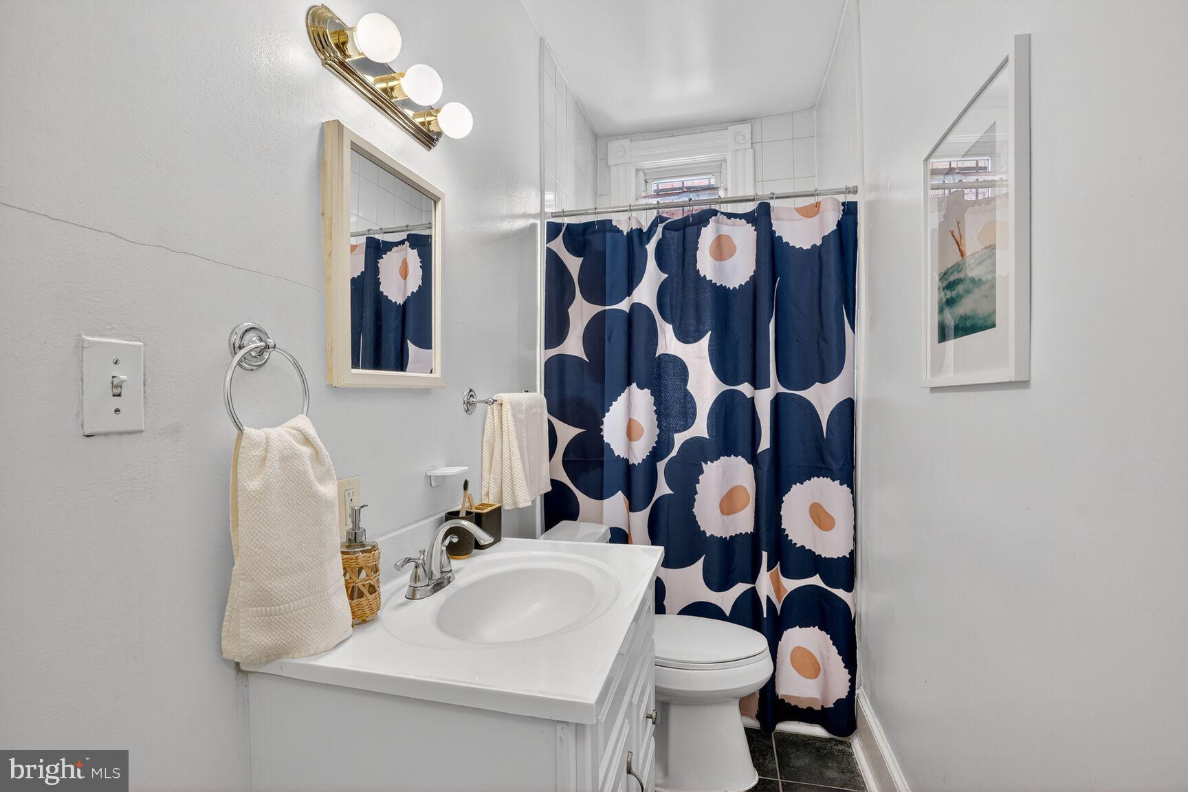 1634 R Street Northwest Washington, DC 20009 - Photo 16 of 30 a bathroom with a sink and mirror with toilet