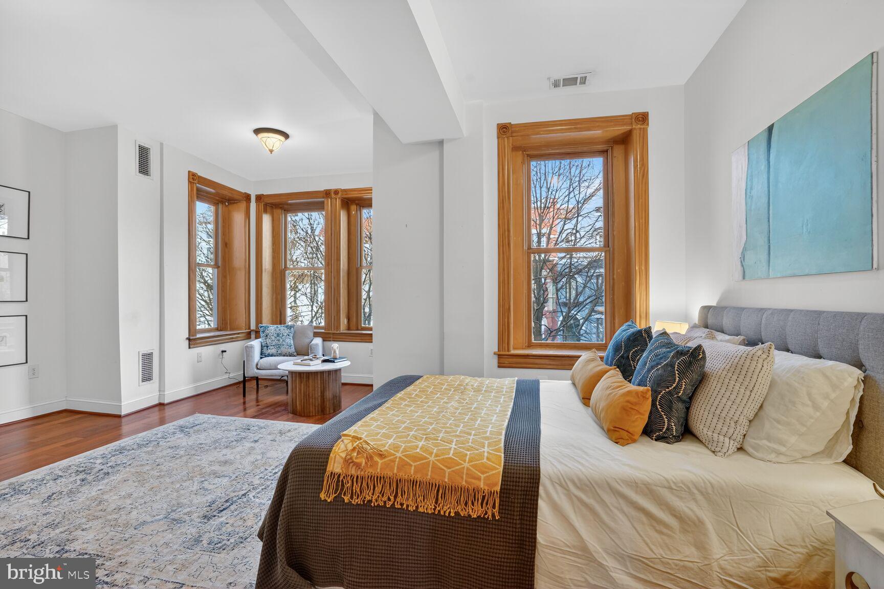 1634 R Street Northwest Washington, DC 20009 - Photo 18 of 30 a bedroom with a bed and windows