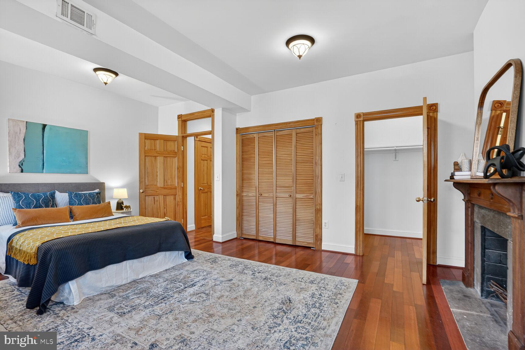 1634 R Street Northwest Washington, DC 20009 - Photo 20 of 30 a bedroom with a bed and wooden floor