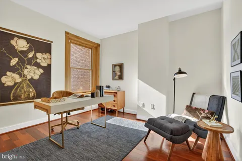 a workspace with furniture and a window