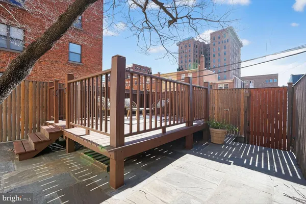 a view of outdoor space with deck and furniture