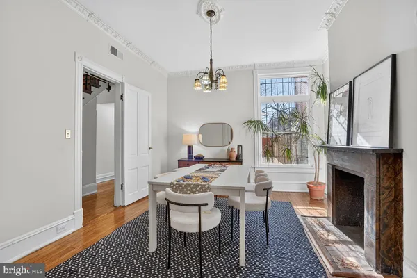 a view of a livingroom with furniture and a fireplace