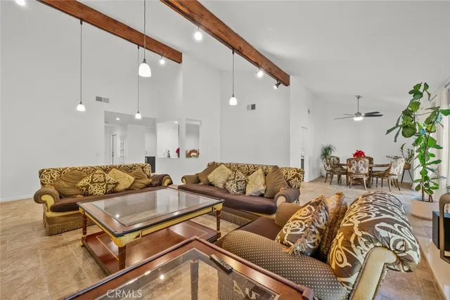 a bathroom with a granite countertop sink a toilet and a mirror