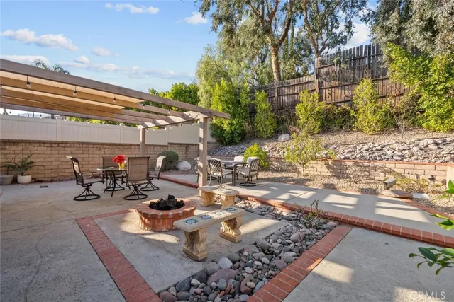 a view of a dinning table and chairs in the patio