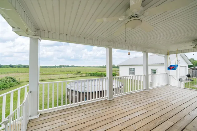 a view of a balcony with wooden floor