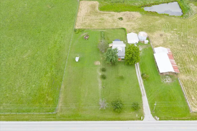 a view of a yard with a swimming pool