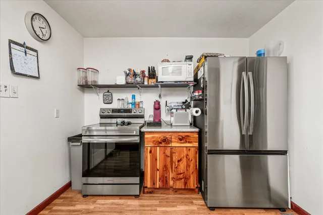 a bedroom with a bed and a flat tv screen