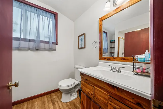 a view of balcony with furniture and a garden