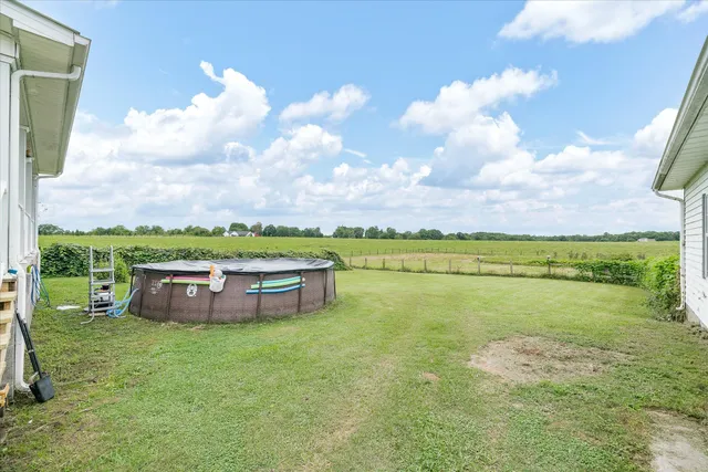 a view of a lake with houses in the back