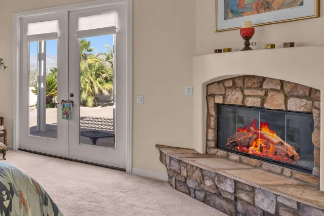 a view of a livingroom with wooden floor and furniture