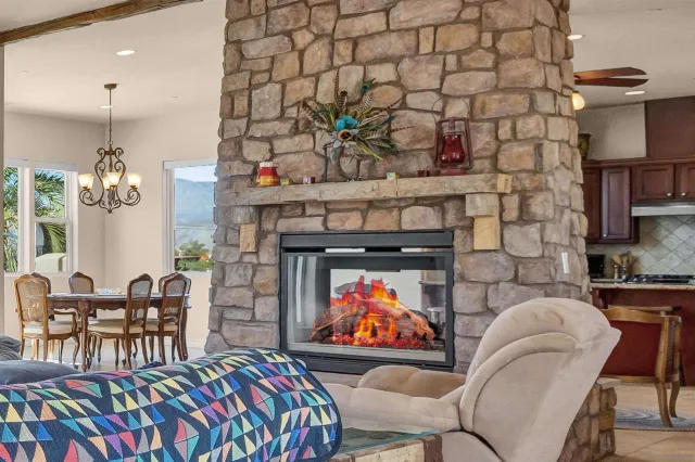 a living room filled with furniture and a fireplace