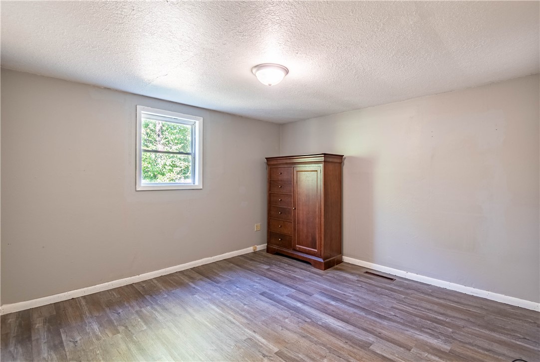 4016 Bayview Drive Decatur, IL 62521 - Photo 7 of 15 an empty room with wooden floor and window