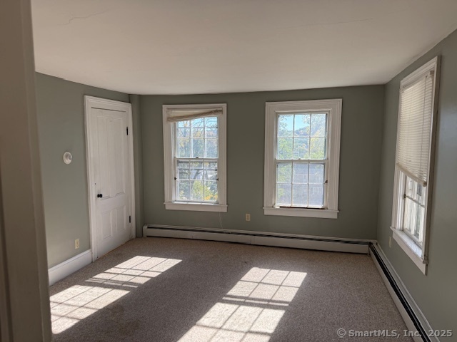 41 Spring Street Windham, CT 06226 - Photo 11 of 15 a view of an empty room with a window