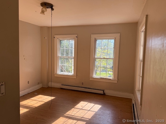 41 Spring Street Windham, CT 06226 - Photo 4 of 15 a view of an empty room with a window