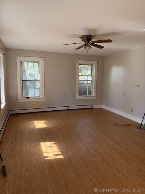 41 Spring Street Windham, CT 06226 - Photo 6 of 15 wooden floor in an empty room with a window