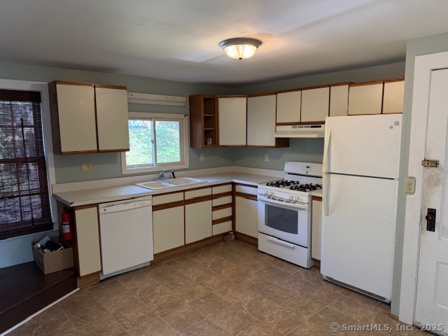 41 Spring Street Windham, CT 06226 - Photo 7 of 15 a kitchen with granite countertop white cabinets and white appliances