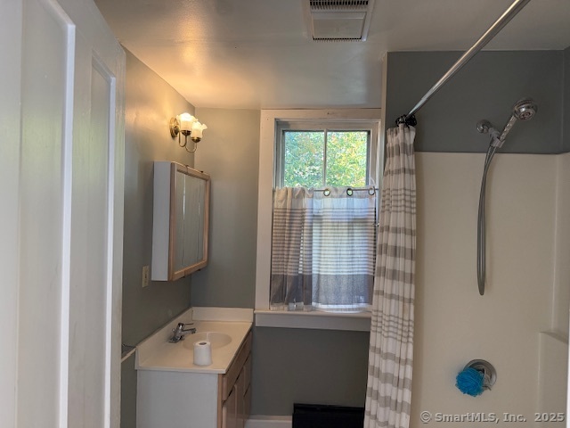 41 Spring Street Windham, CT 06226 - Photo 8 of 15 a bathroom with a sink and mirror