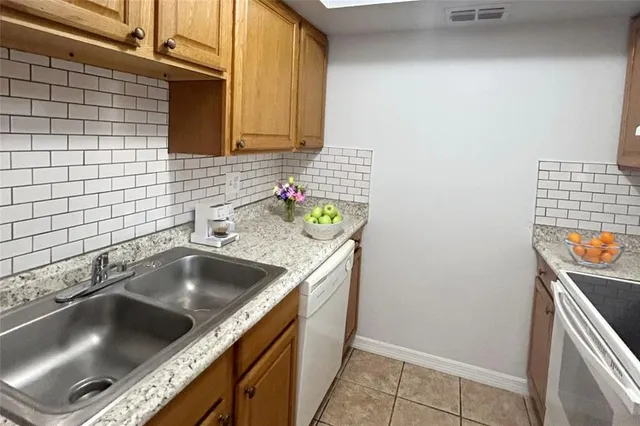 a kitchen with a sink and a stove