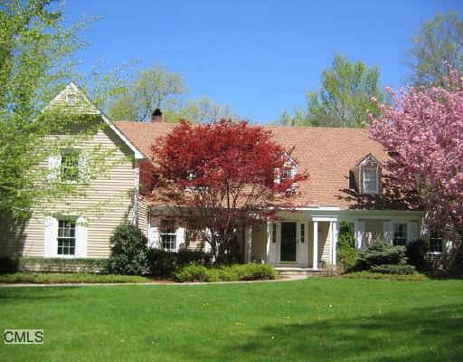 67 Lincoln Lane Ridgefield, CT 06877 - Photo 1 of 1 a front view of a house with a garden