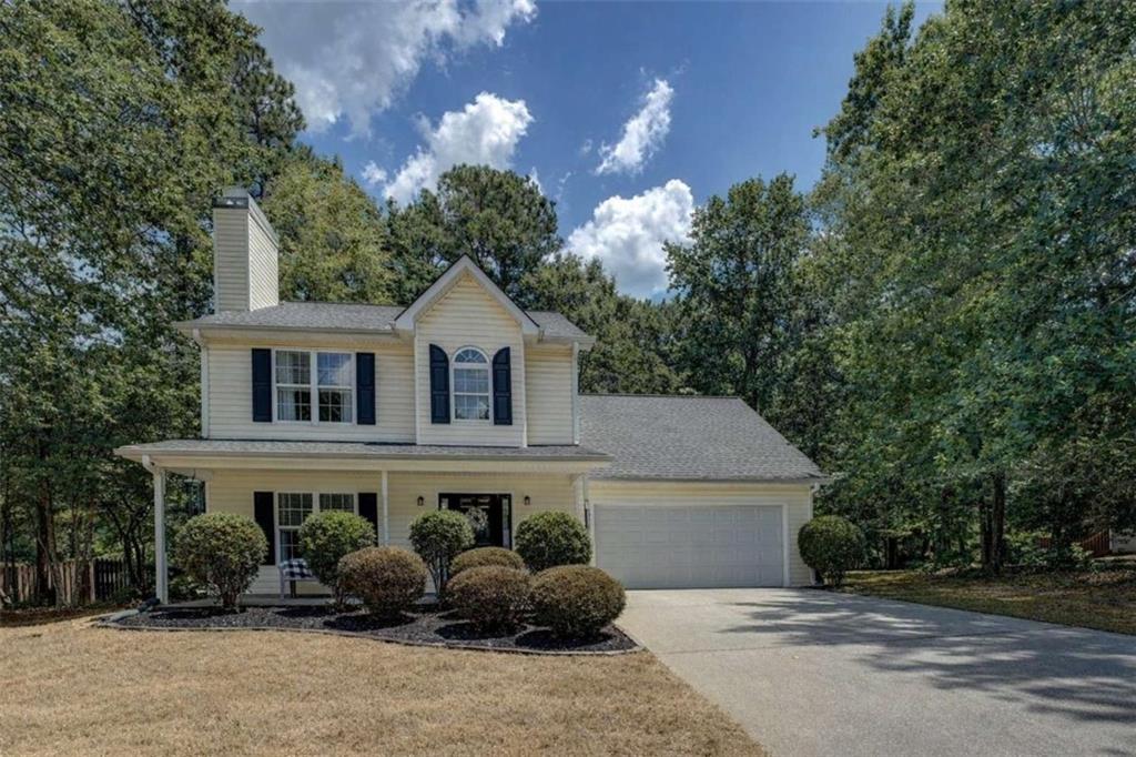 530 Windermere Drive Loganville, GA 30052 - Photo 1 of 1 a view of a white house with large trees and outdoor space