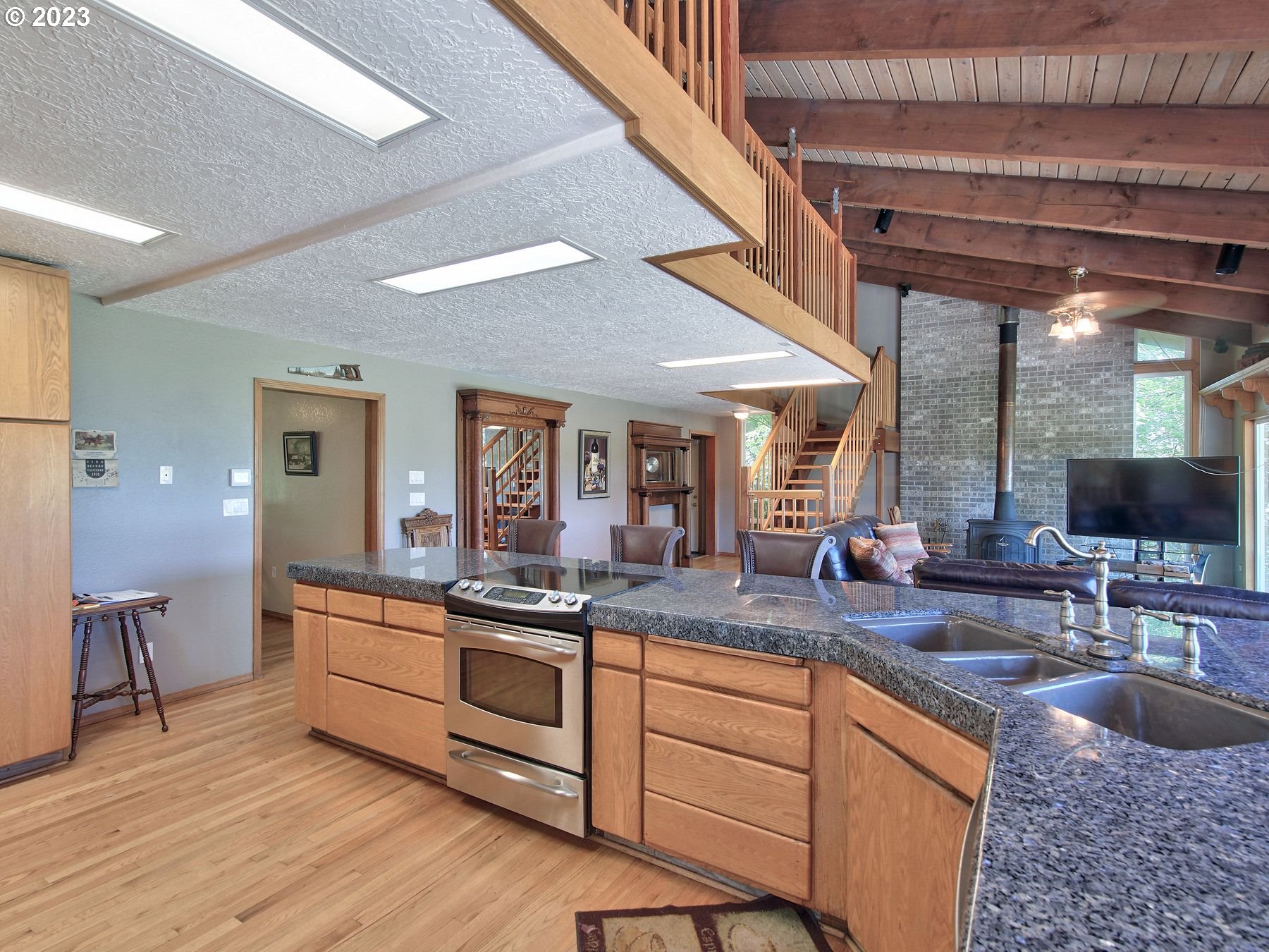 12773 South Union Hall Road Canby, OR 97013 - Photo 11 of 47 a kitchen with sink and view living room