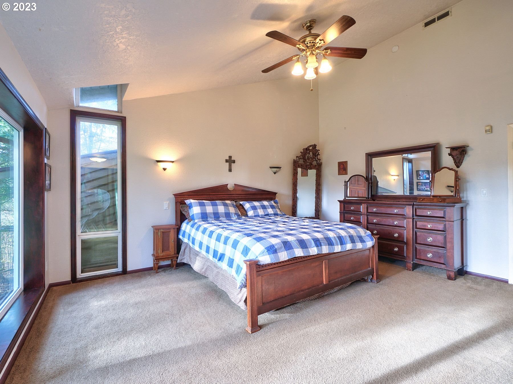 12773 South Union Hall Road Canby, OR 97013 - Photo 28 of 47 a bedroom with a bed and a chandelier