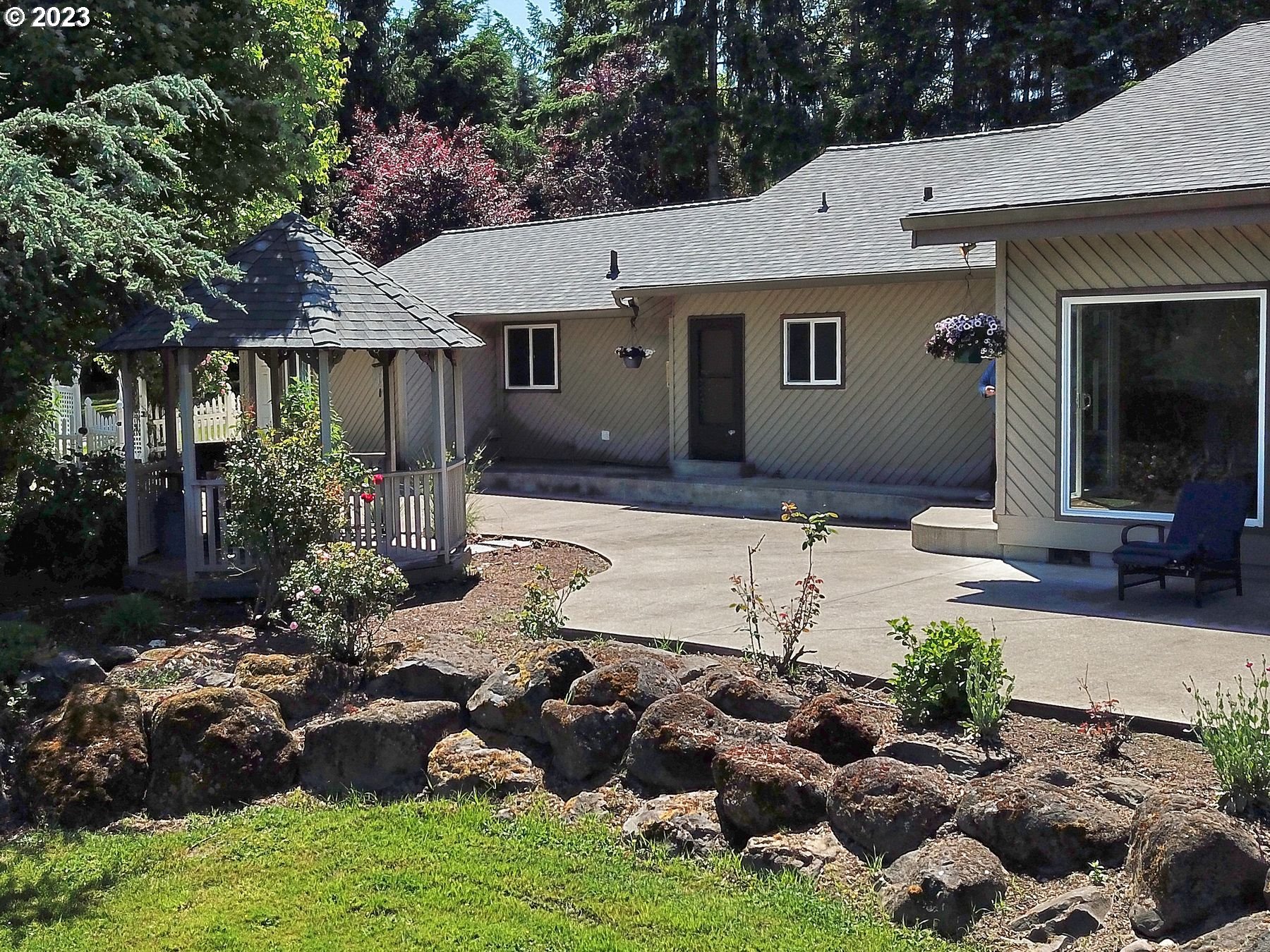 12773 South Union Hall Road Canby, OR 97013 - Photo 37 of 47 a view of a house with yard and sitting area
