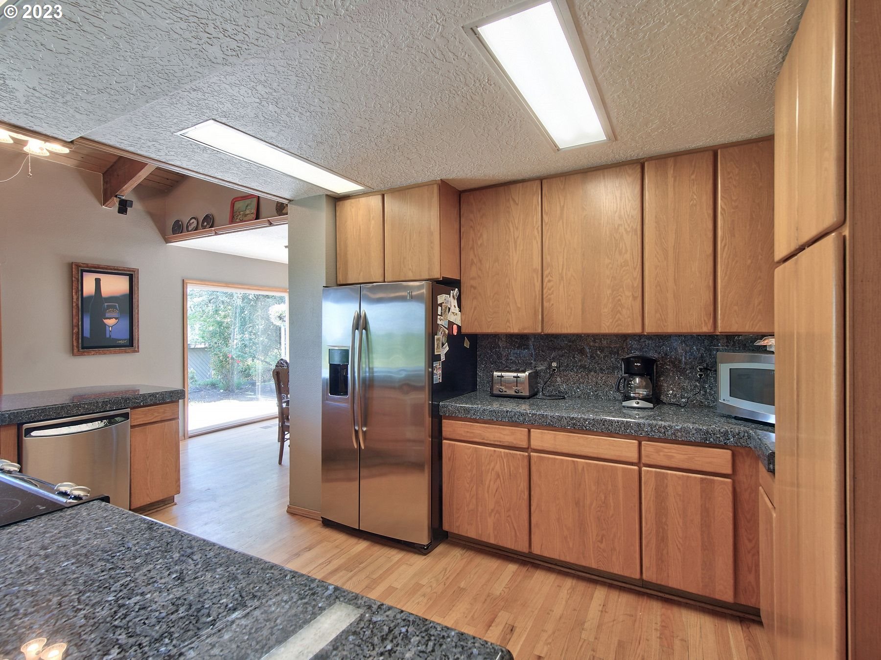 12773 South Union Hall Road Canby, OR 97013 - Photo 8 of 47 a kitchen with stainless steel appliances granite countertop a sink stove and refrigerator