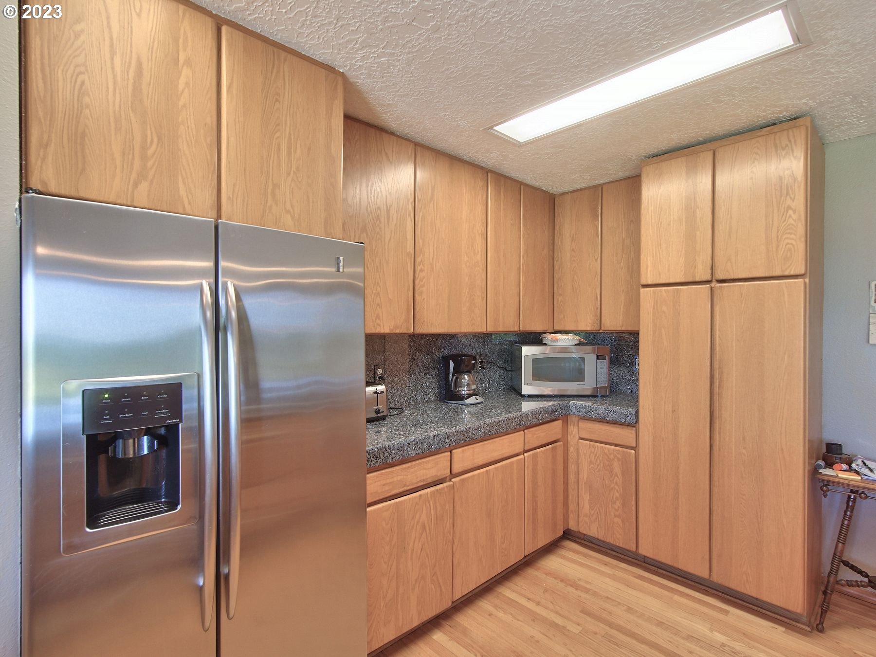 12773 South Union Hall Road Canby, OR 97013 - Photo 9 of 47 a kitchen with a refrigerator sink and cabinets