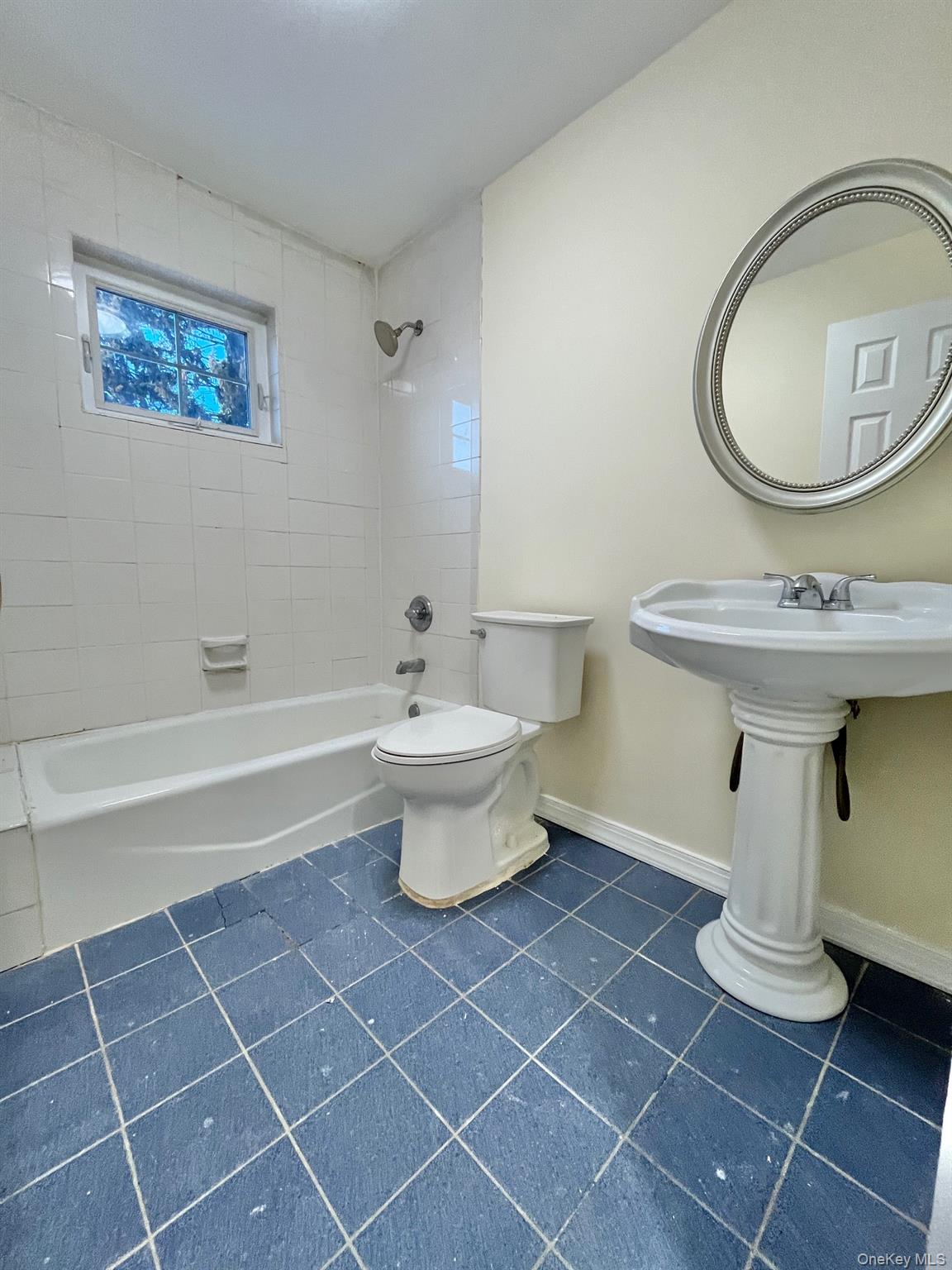 51 Emmett Terrace, Unit 1 New Rochelle, NY 10805 - Photo 14 of 23 a bathroom with a toilet a sink and mirror