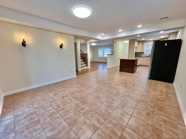 a view of a livingroom with a kitchen