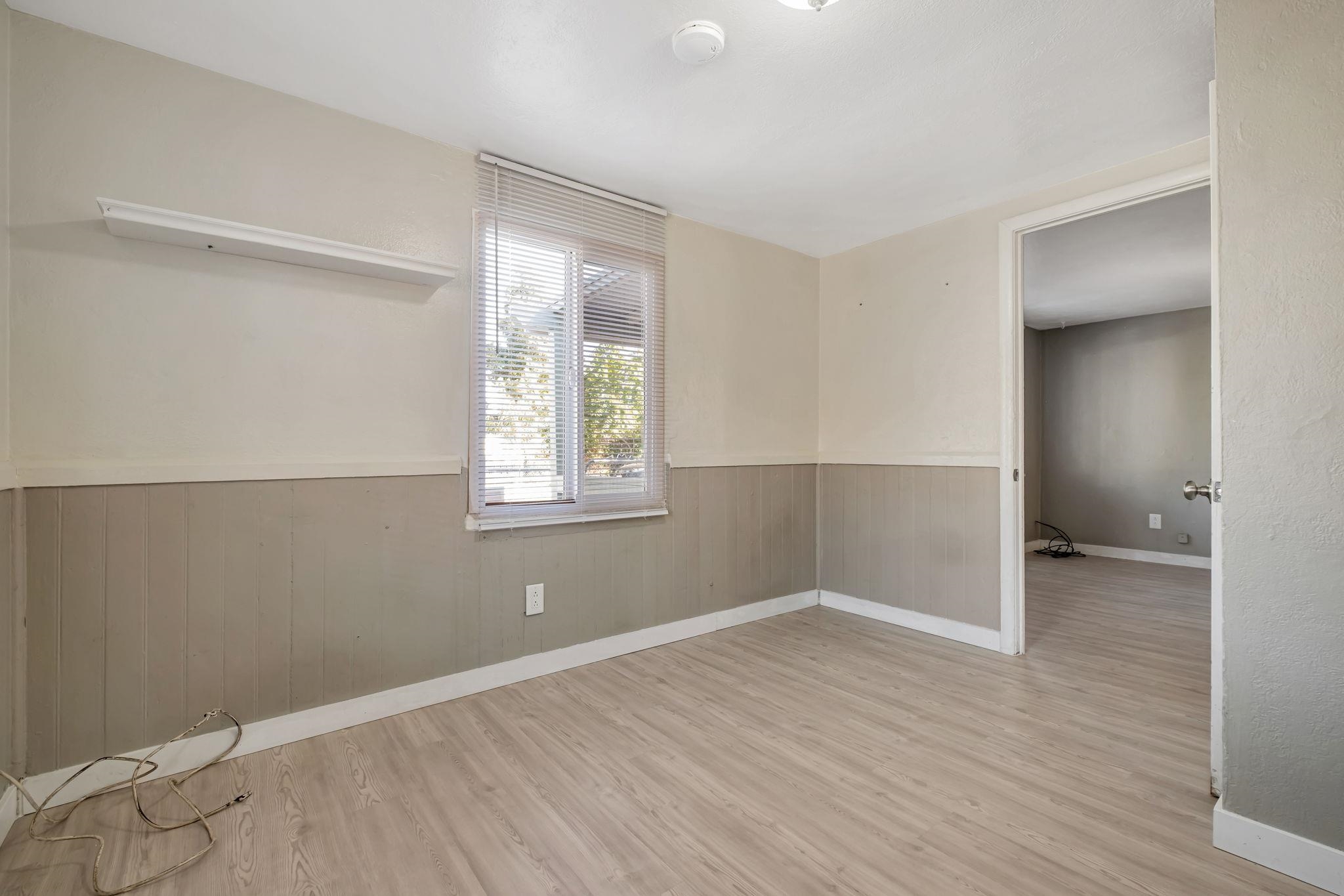 118 Sycamore Street Fremont, CA 94536 - Photo 14 of 30 an empty room with wooden floor and windows