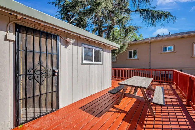 a balcony view with a seating space