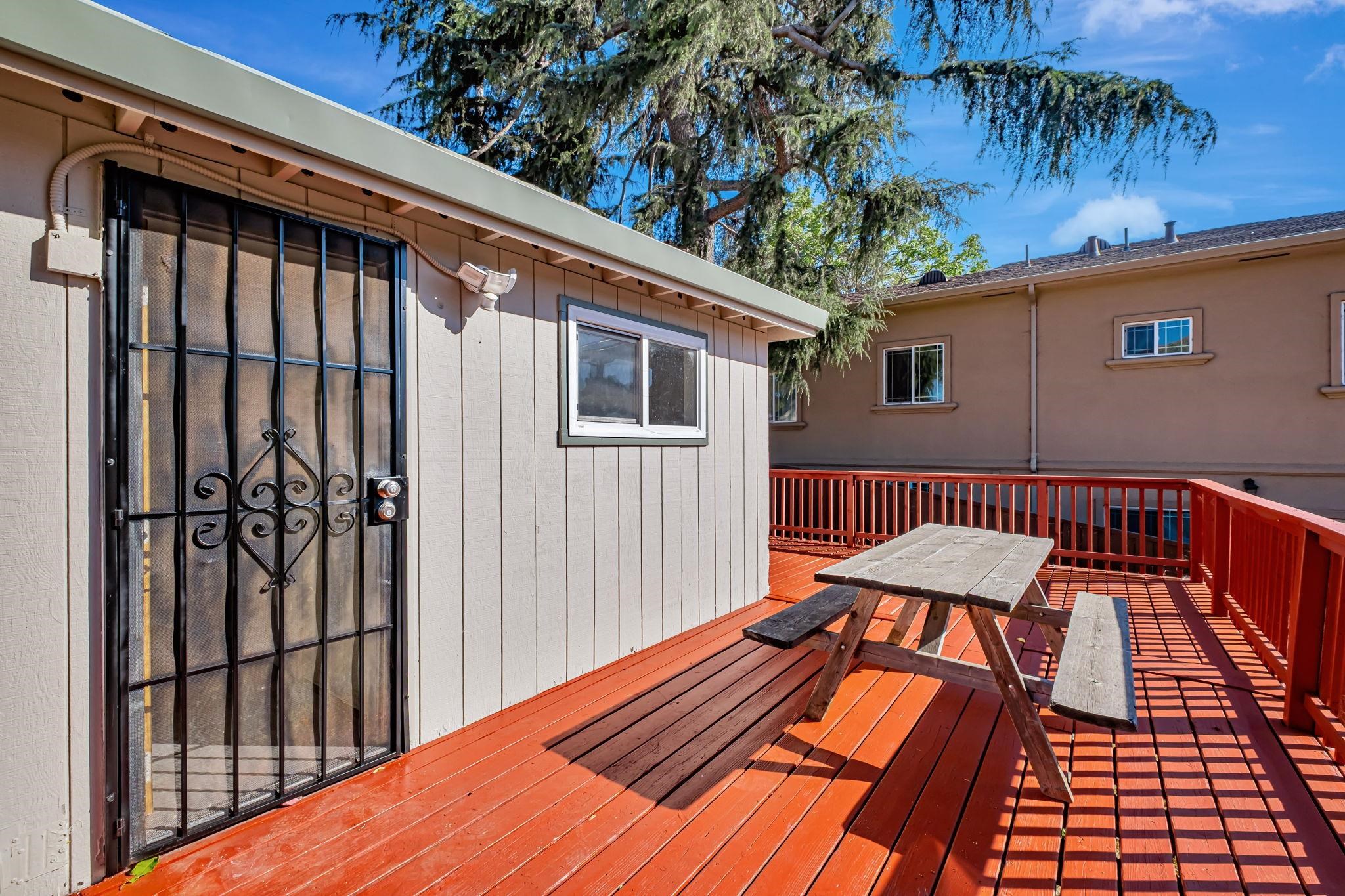118 Sycamore Street Fremont, CA 94536 - Photo 24 of 30 a view of a roof deck with wooden floor and fence