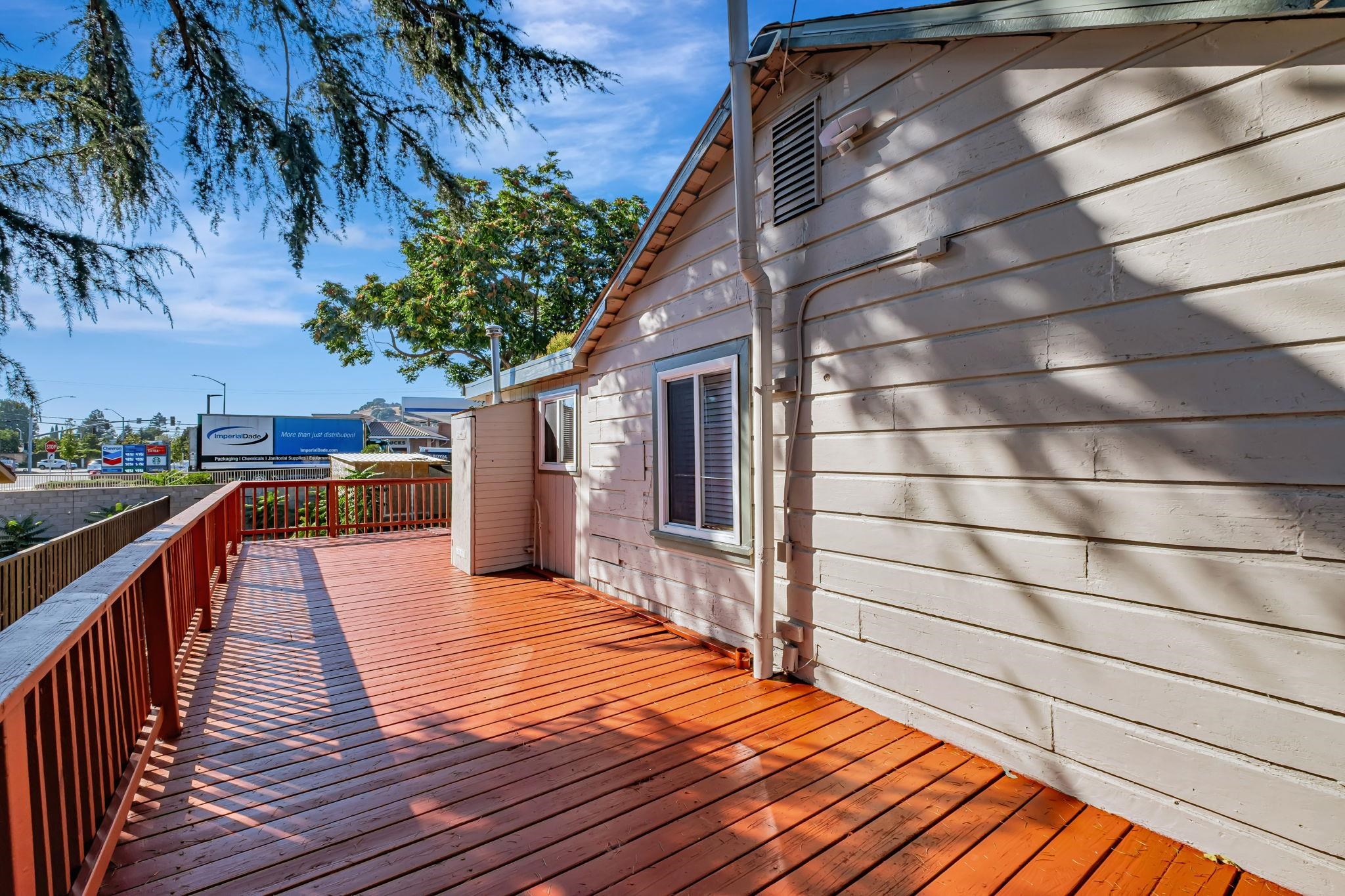 118 Sycamore Street Fremont, CA 94536 - Photo 26 of 30 a balcony with wooden floor and potted plants
