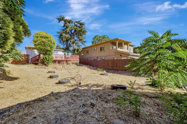 a view of a backyard of the house